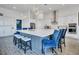 Modern kitchen with large island, stainless steel appliances and white cabinets at 13265 Alderley Dr, Orlando, FL 32832