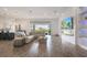 Open living space with hardwood floors, large TV and fireplace at 13265 Alderley Dr, Orlando, FL 32832