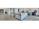 Open concept living and kitchen with large island and seating at 13265 Alderley Dr, Orlando, FL 32832