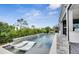 Modern pool with built-in seating and fountains at 13265 Alderley Dr, Orlando, FL 32832