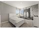 Cozy bedroom featuring a unique Brooklyn Bridge mural wall and natural light at 13596 Gorgona Isle Dr, Windermere, FL 34786
