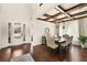 Elegant dining room featuring wood floors, high ceilings, a decorative ceiling, and elegant lighting at 13596 Gorgona Isle Dr, Windermere, FL 34786