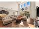 Spacious living room featuring wood floors, high ceilings, lots of windows, and an open floor plan at 13596 Gorgona Isle Dr, Windermere, FL 34786
