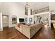 Elegant living room with wood floors, high ceilings, large windows, and staircase to the second floor at 13596 Gorgona Isle Dr, Windermere, FL 34786
