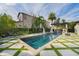 Inviting backyard pool area with lush landscaping and a pergola at 13596 Gorgona Isle Dr, Windermere, FL 34786