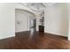 Spacious dining room featuring dark hardwood floors and modern lighting fixture at 14518 Josair Dr, Orlando, FL 32826