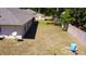 Aerial view of the home with fenced backyard, and shed at 18148 Villa City Rd, Groveland, FL 34736