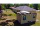 Aerial view of the home with a storage shed in the backyard at 18148 Villa City Rd, Groveland, FL 34736
