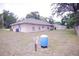 View of the spacious backyard with a well and storage shed at 18148 Villa City Rd, Groveland, FL 34736