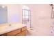 Bathroom with shower-tub combo, built-in shelves, and a single sink vanity at 18148 Villa City Rd, Groveland, FL 34736