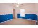 Neutral bedroom featuring a ceiling fan and decorative paint at 18148 Villa City Rd, Groveland, FL 34736