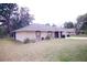 Charming single-story home with well-maintained lawn and neutral exterior at 18148 Villa City Rd, Groveland, FL 34736