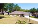 Charming single-story home with well-maintained lawn and landscaping at 18148 Villa City Rd, Groveland, FL 34736