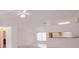 Bright living room with ceiling fan and natural light at 18148 Villa City Rd, Groveland, FL 34736