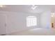 Bright living room with large window and neutral color scheme at 18148 Villa City Rd, Groveland, FL 34736