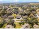 Overhead aerial of townhomes, showing the property's location and surrounding neighborhood with lush mature landscaping at 2214 Se Sawgrass Ct, Winter Haven, FL 33884