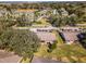 Community aerial showcasing tree-lined streets, community landscaping, and carports in a desirable neighborhood at 2214 Se Sawgrass Ct, Winter Haven, FL 33884