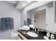 Bathroom featuring vanity with dark countertops, towels, and toiletries at 2214 Se Sawgrass Ct, Winter Haven, FL 33884