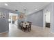Inviting dining room, with a table set for four, adjacent to the kitchen and living room at 2214 Se Sawgrass Ct, Winter Haven, FL 33884
