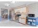 Efficient kitchen layout with stainless steel appliances and ample counter space at 2214 Se Sawgrass Ct, Winter Haven, FL 33884