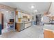 Well-lit kitchen boasting spacious countertops, stainless steel appliances, and ample cabinet storage at 2214 Se Sawgrass Ct, Winter Haven, FL 33884