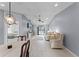 Open-concept living area showcasing neutral tones, tile floors, and a dining space at 2214 Se Sawgrass Ct, Winter Haven, FL 33884