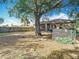 Spacious backyard featuring a mature shade tree and a full wooden perimeter fence at 2218 W Gore St, Orlando, FL 32805