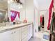 Bathroom with double sinks, granite counters and walk in closet at 2218 W Gore St, Orlando, FL 32805