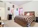 Cozy bedroom with neutral walls, carpet floors, and ensuite bath at 2218 W Gore St, Orlando, FL 32805