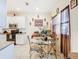 Bright dining area with a glass table, white cabinets, and modern decor at 2218 W Gore St, Orlando, FL 32805