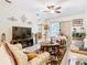 Inviting living room with stylish decor, light wood floors, and access to an enclosed patio at 2218 W Gore St, Orlando, FL 32805