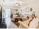 Spacious living room with plush furnishings, light wood floors, and a sliding glass door at 2218 W Gore St, Orlando, FL 32805