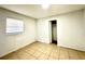Small bedroom with tile floors and closet at 222 Haynes St, Daytona Beach, FL 32114