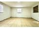 Simple bedroom with tile floors and a window at 222 Haynes St, Daytona Beach, FL 32114