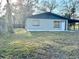 Side view of a freshly painted house with carport at 222 Haynes St, Daytona Beach, FL 32114