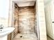 Shower stall with light brown tile walls at 222 Haynes St, Daytona Beach, FL 32114