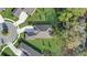 An aerial view showcasing the home's roof, landscaping, and proximity to the cul-de-sac at 25974 High Hampton Cir, Sorrento, FL 32776