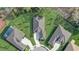 Aerial view of the home's roof, driveway, landscaping, and proximity to neighbors at 25974 High Hampton Cir, Sorrento, FL 32776
