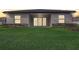 A peaceful backyard boasts a well-maintained lawn and trimmed hedges, ensuring privacy at 25974 High Hampton Cir, Sorrento, FL 32776