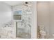 Elegant bathroom with a glass enclosed shower, marble finishes, and a soaking tub at 25974 High Hampton Cir, Sorrento, FL 32776