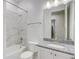 Stylish bathroom with white marble tile, granite countertop, and chrome fixtures at 25974 High Hampton Cir, Sorrento, FL 32776