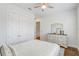 Bedroom featuring stylish decor, a ceiling fan, and plenty of closet space at 25974 High Hampton Cir, Sorrento, FL 32776