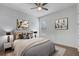 Comfortable bedroom featuring stylish decor, a ceiling fan, and plenty of natural light at 25974 High Hampton Cir, Sorrento, FL 32776