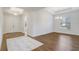 Open-concept dining room with hardwood floors, modern chandelier, and lots of natural light at 25974 High Hampton Cir, Sorrento, FL 32776