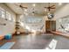 Exercise room with mirrors, exercise equipment, and ceiling fans at 25974 High Hampton Cir, Sorrento, FL 32776