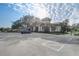 Exterior view of the community building with ample parking at 25974 High Hampton Cir, Sorrento, FL 32776