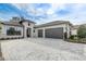 Home with two-car garage, manicured landscaping, brick accents, and tile roof at 25974 High Hampton Cir, Sorrento, FL 32776