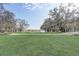Picturesque view of the golf course and surrounding lush green landscape at 25974 High Hampton Cir, Sorrento, FL 32776