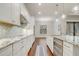 Modern kitchen with stainless steel appliances and granite countertops at 25974 High Hampton Cir, Sorrento, FL 32776