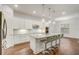 Modern kitchen with stainless steel appliances, granite countertops, and a breakfast bar at 25974 High Hampton Cir, Sorrento, FL 32776
